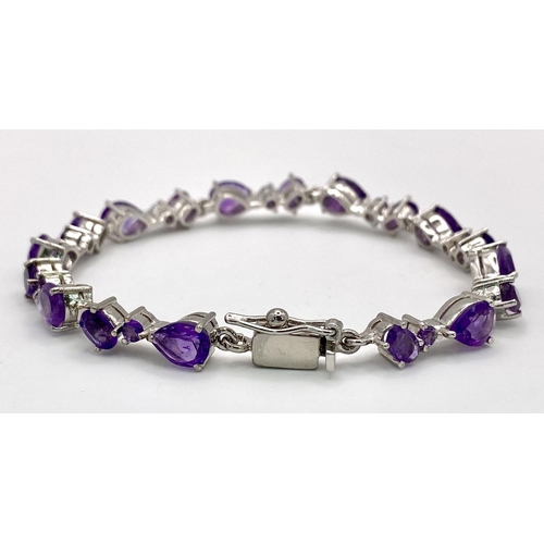 245 - An Amethyst Tennis Bracelet. Set in 925 Sterling Silver. 27ctw. W-17.20g.19cm. Ref: HV-2170