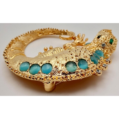 279 - A very glamorous, well proportioned, gold plated and gem studded chameleon brooch, in a presentation... 