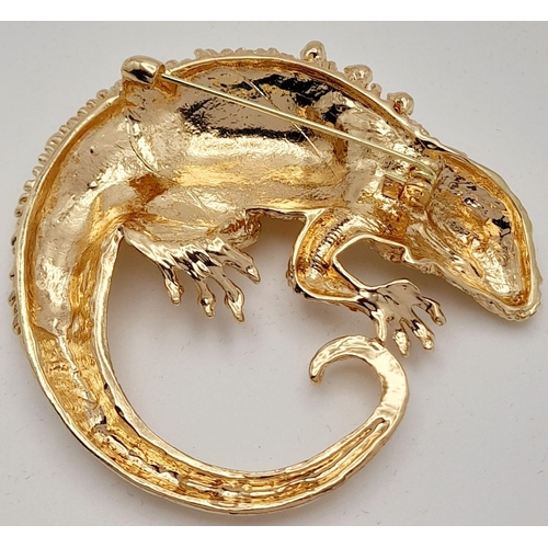 279 - A very glamorous, well proportioned, gold plated and gem studded chameleon brooch, in a presentation... 