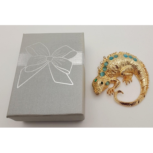 279 - A very glamorous, well proportioned, gold plated and gem studded chameleon brooch, in a presentation... 