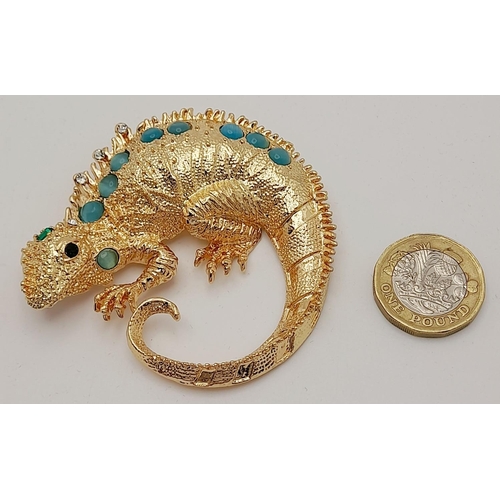 279 - A very glamorous, well proportioned, gold plated and gem studded chameleon brooch, in a presentation... 