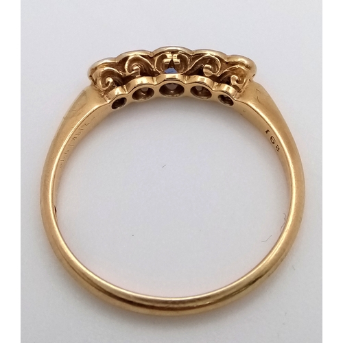 12 - An 18K Gold (tested) Diamond and Pale Blue Sapphire Ring. Size O. 2.6g total weight.