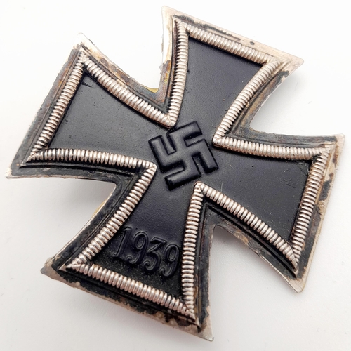 148 - WW2 Cased German Iron Cross 1st Class. The award is of 3 part construction with an iron core.