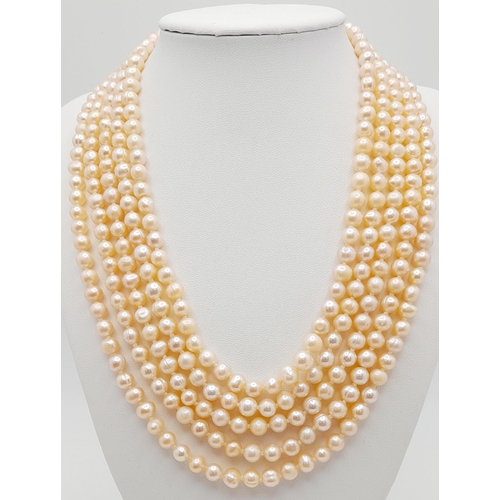 153 - A statement five row pink, cultured pearl necklace accompanied by a pair of pink pearl stud earrings... 