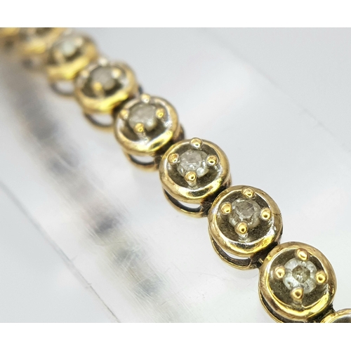 24 - A Vintage 9K Yellow Gold Diamond Tennis Bracelet. 19cm. 5.8g total weight.