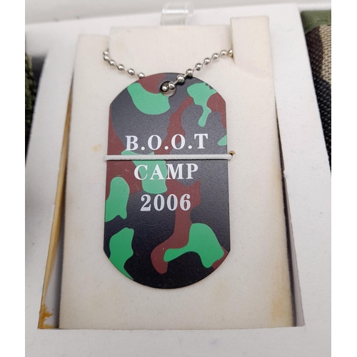 251 - A U.S.A. Army Boot Camp set (dated 2006) consisting of a watch with compass, a dog tag with chain, a... 