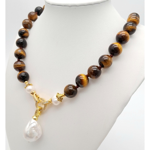 342 - A Rich Tigers Eye Beaded Necklace with a Hanging Keisha Baroque Pearl Pendant. 12mm beads.