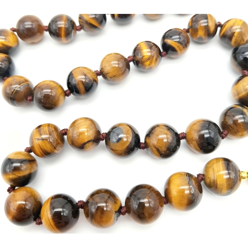 342 - A Rich Tigers Eye Beaded Necklace with a Hanging Keisha Baroque Pearl Pendant. 12mm beads.