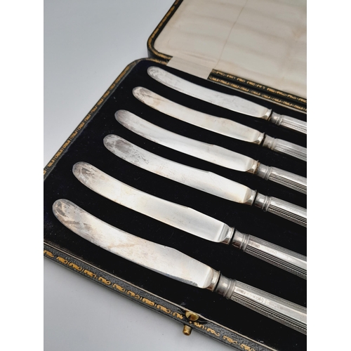 56 - Set of 6 1917 Silver Hallmarked Butter Knives with the badge of the Machine Gun Corps.