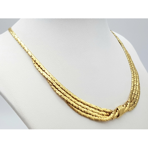 99 - A Stylish Italian 18K Yellow Gold Choker Necklace. A single to a four row centre with buckle decorat... 