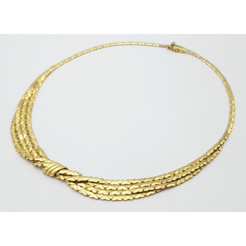 99 - A Stylish Italian 18K Yellow Gold Choker Necklace. A single to a four row centre with buckle decorat... 