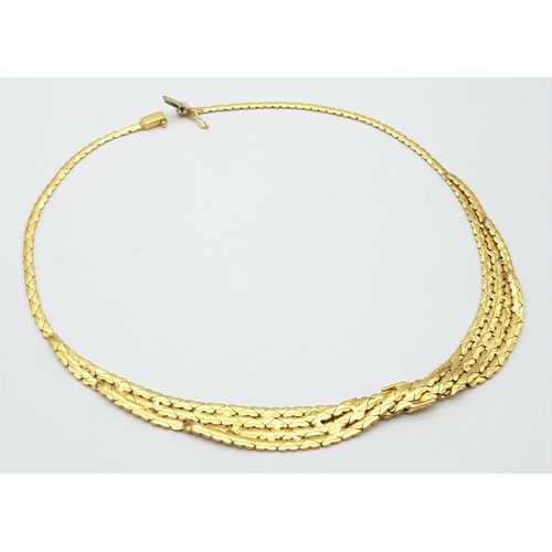 99 - A Stylish Italian 18K Yellow Gold Choker Necklace. A single to a four row centre with buckle decorat... 