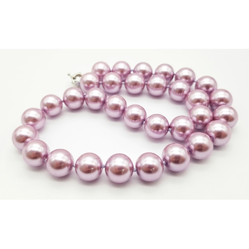 488 - An Exotic Lavender South Sea Pearl Shell Beaded Necklace. 14mm beads. 44cm necklace length