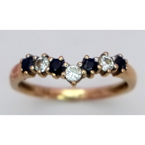 571 - A 9K Yellow Gold Sapphire and White Zircon Chevron Ring. Size M. 1.5g total weight.