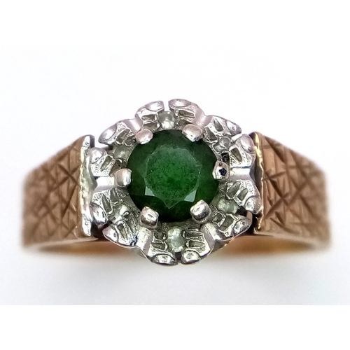 578 - A Vintage 9K Peridot and Diamond Ring. Central round cut peridot with a diamond halo. Size L. 3.4g t... 