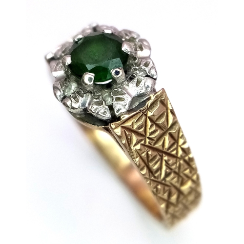 578 - A Vintage 9K Peridot and Diamond Ring. Central round cut peridot with a diamond halo. Size L. 3.4g t... 