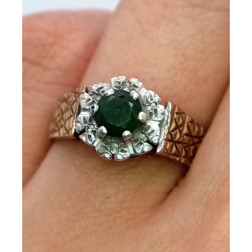 578 - A Vintage 9K Peridot and Diamond Ring. Central round cut peridot with a diamond halo. Size L. 3.4g t... 