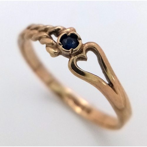 580 - A 9K Yellow Gold and Sapphire Love Ring. Size J. 1.1g weight.