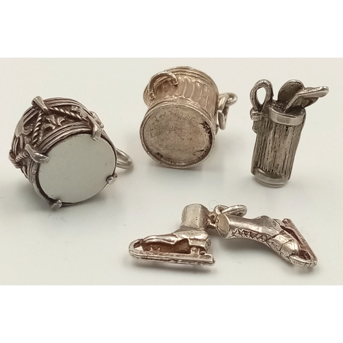 1694 - A SELECTION OF 4 X STERLING SILVER CHARMS - DUSTBIN, ICE SKATES, GOLF BAG WITH CLUBS, AND DRUM. 9g t... 