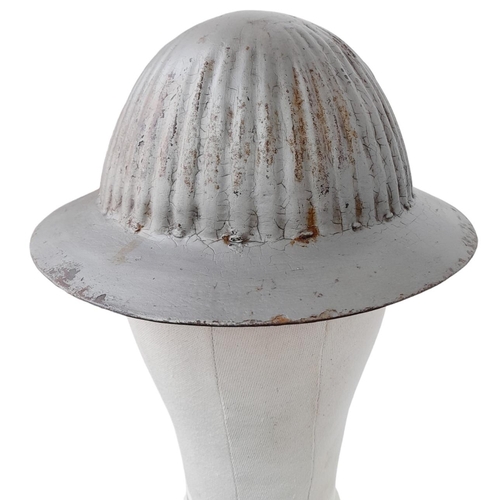 194 - WW1 Portuguese 1916 Helmet complete with original liner and chinstrap. The helmet was used again dur... 