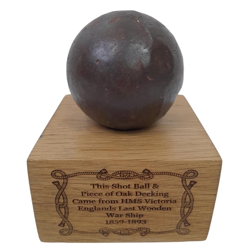 482 - Iron Shot Ball Mounted on a piece of Oak Decking Board that was taken from the British Warship HMS
V... 