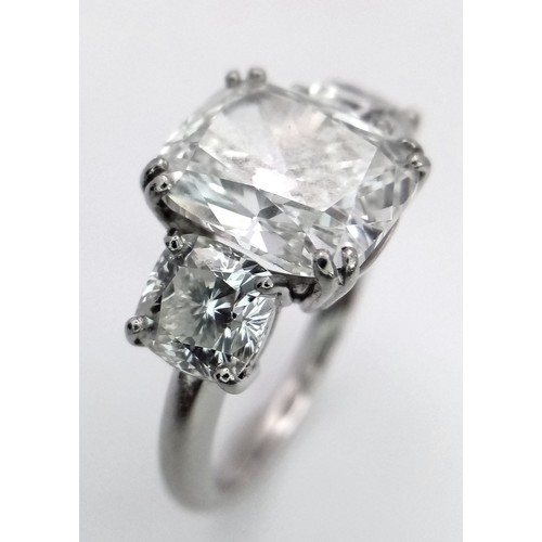 100 - A Breathtaking 4.01ct GIA Certified Diamond Ring. A brilliant cushion cut 4.01ct central diamond of ... 