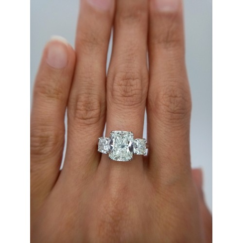 100 - A Breathtaking 4.01ct GIA Certified Diamond Ring. A brilliant cushion cut 4.01ct central diamond of ... 