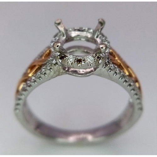 134 - A 18K TWO GOLD TONE DIAMOND SET HALO RING WITH DIAMOND SPLIT SHOULDERS. 0.26CT DIAMONDS. READY TO SE... 