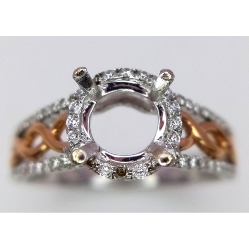 134 - A 18K TWO GOLD TONE DIAMOND SET HALO RING WITH DIAMOND SPLIT SHOULDERS. 0.26CT DIAMONDS. READY TO SE... 