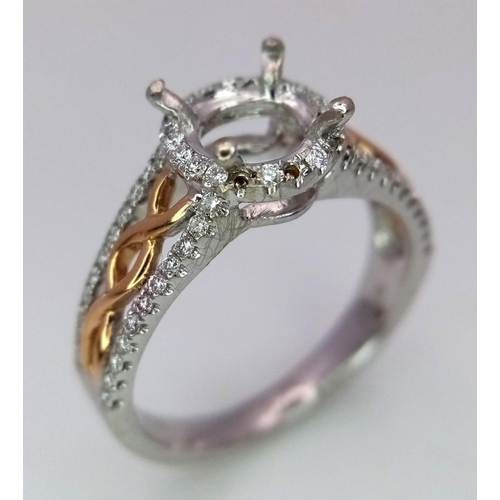 134 - A 18K TWO GOLD TONE DIAMOND SET HALO RING WITH DIAMOND SPLIT SHOULDERS. 0.26CT DIAMONDS. READY TO SE... 