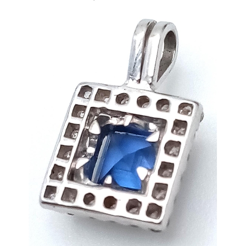 210 - A 18K (TESTED AS)  WHITE GOLD DIAMOND & SAPPHIRE PENDANT 1.02CT SAPPHIRE 1.6G. 14mm x 9mm.

BL 9003