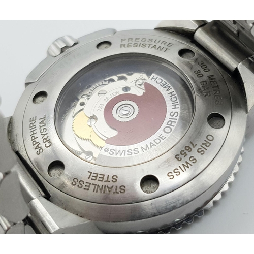 247 - An Oris Automatic Divers Watch. Pressure resistant to 300M - Model 7653. Stainless steel bracelet an... 