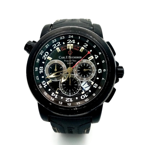 303 - A Carl F. Bucherer Travel Tec GMT Chronograph Automatic Gents Watch. Black vulcanised rubber strap. ... 