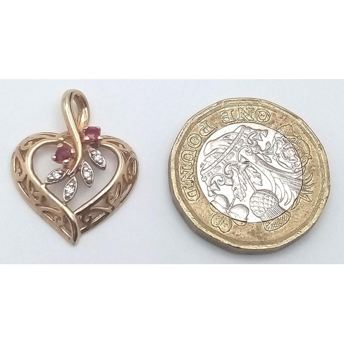 408 - A 14K (TESTED AS) YELLOW GOLD DIAMOND & RUBY SET HEART PENDANT 2.3G 22mm x 18mm.

SC 9073