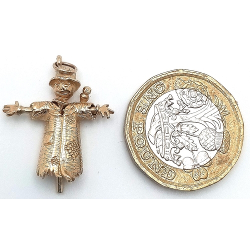 506 - A 9K YELLOW GOLD SCARECROW CHARM WITH MOVING PARTS. 28mm length, 3.2g weight. Ref: SC 9056