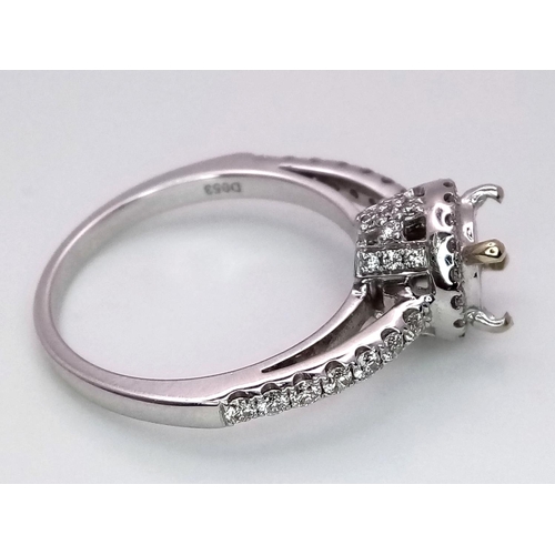 52 - AN 18K WHITE GOLD DIAMOND HALO SOLITAIRE RING MOUNT WITH DIAMOND SET SHOULDERS. Ready to set your dr... 