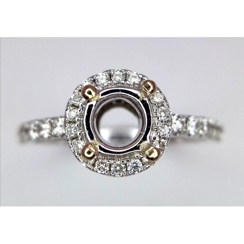 52 - AN 18K WHITE GOLD DIAMOND HALO SOLITAIRE RING MOUNT WITH DIAMOND SET SHOULDERS. Ready to set your dr... 