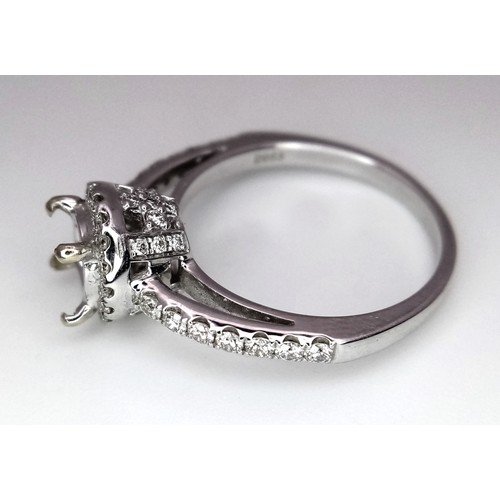 52 - AN 18K WHITE GOLD DIAMOND HALO SOLITAIRE RING MOUNT WITH DIAMOND SET SHOULDERS. Ready to set your dr... 