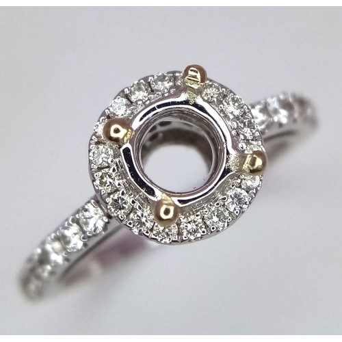 52 - AN 18K WHITE GOLD DIAMOND HALO SOLITAIRE RING MOUNT WITH DIAMOND SET SHOULDERS. Ready to set your dr... 