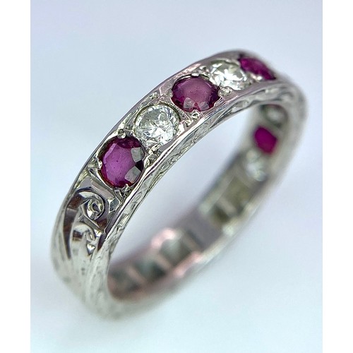 73 - AN 18K WHITE GOLD DIAMOND & RUBY BAND RING. 0.25ctw, size L, 4.1g total weight. Ref: SC 9038