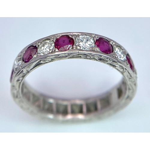 73 - AN 18K WHITE GOLD DIAMOND & RUBY BAND RING. 0.25ctw, size L, 4.1g total weight. Ref: SC 9038