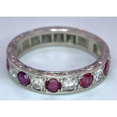 73 - AN 18K WHITE GOLD DIAMOND & RUBY BAND RING. 0.25ctw, size L, 4.1g total weight. Ref: SC 9038