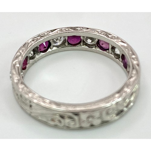 73 - AN 18K WHITE GOLD DIAMOND & RUBY BAND RING. 0.25ctw, size L, 4.1g total weight. Ref: SC 9038