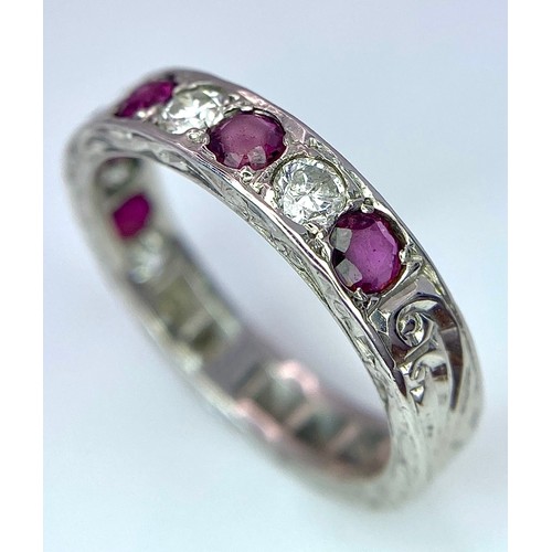 73 - AN 18K WHITE GOLD DIAMOND & RUBY BAND RING. 0.25ctw, size L, 4.1g total weight. Ref: SC 9038