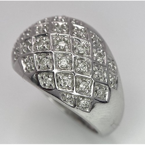 75 - A 9K WHITE GOLD DIAMOND SET BOMBE RING 0.25CT 10.2G SIZE O.

SC 9010