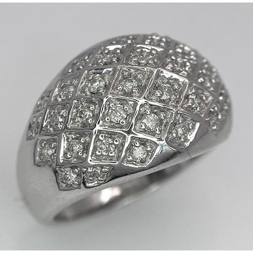 75 - A 9K WHITE GOLD DIAMOND SET BOMBE RING 0.25CT 10.2G SIZE O.

SC 9010