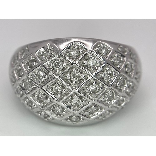 75 - A 9K WHITE GOLD DIAMOND SET BOMBE RING 0.25CT 10.2G SIZE O.

SC 9010