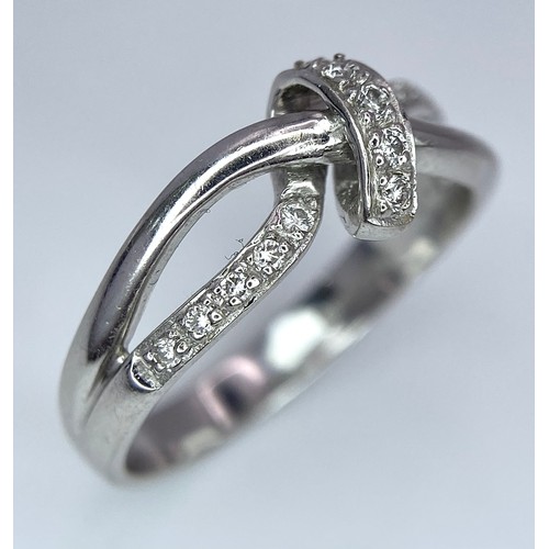 284 - A 18K WHITE GOLD FANCY DIAMOND SET KNOT RING 3.8G SIZE N

BL 9006