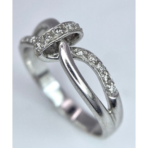 284 - A 18K WHITE GOLD FANCY DIAMOND SET KNOT RING 3.8G SIZE N

BL 9006