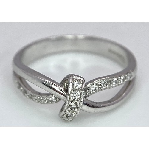 284 - A 18K WHITE GOLD FANCY DIAMOND SET KNOT RING 3.8G SIZE N

BL 9006